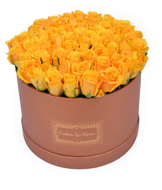 yellow roses in bronze round box