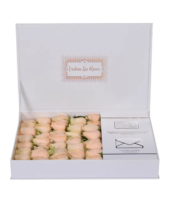peach roses in white box