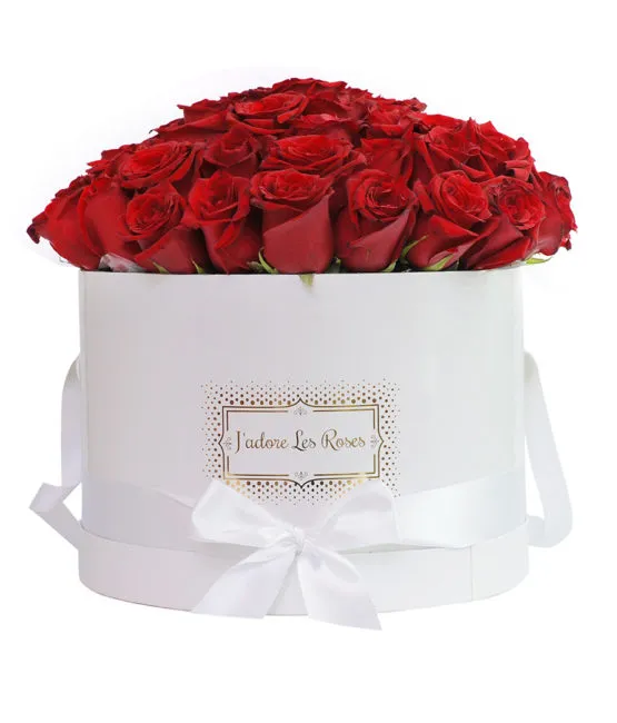 Red roses in white round box